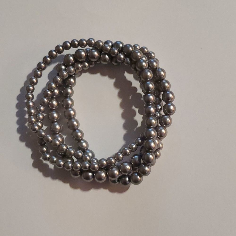 Womens silver colored beaded 4 piece bracelet set